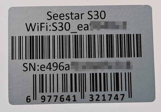 图片展示的是Seestar S30设备本体底部的贴纸，上面印有产品信息。贴纸上显示“Seestar S30”及WiFi名称后缀“WiFi:S30_ea”，其中部分信息被模糊处理。最下方是序列号“SN:e496a”，同样部分被模糊。此外，还有条形码及数字“6 977641 321747”。该图片与文档中查找设备序列号(SN)的内容相关，直观呈现了在设备本体底部贴纸上查找SN的方式。